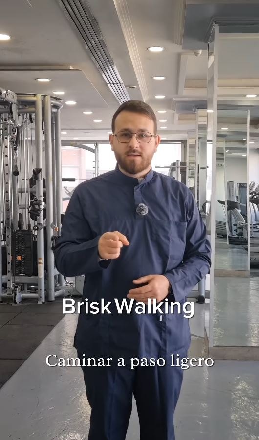 Coach demonstrating brisk walking technique